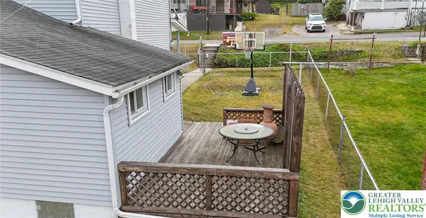 swimming pool view with a seating space