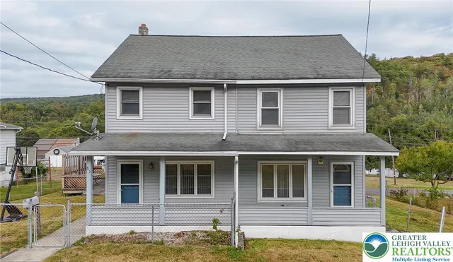 a front view of a house with glass windows