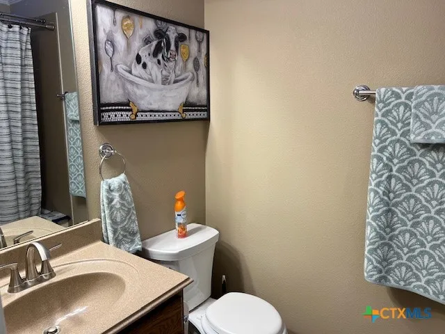 a bathroom with a toilet and sink