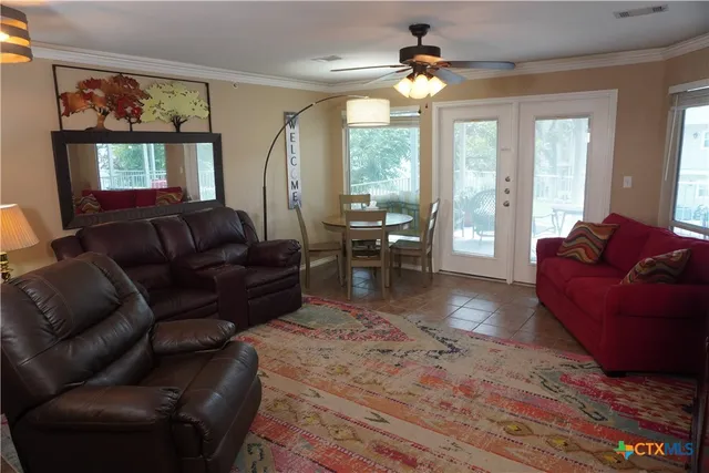 a living room with furniture and a large window