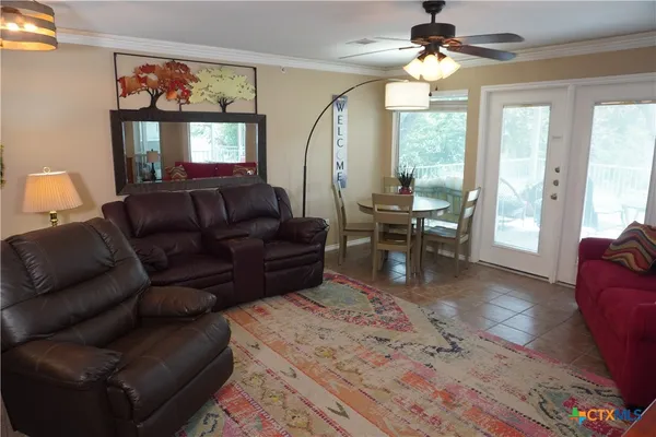 a living room with furniture and a window