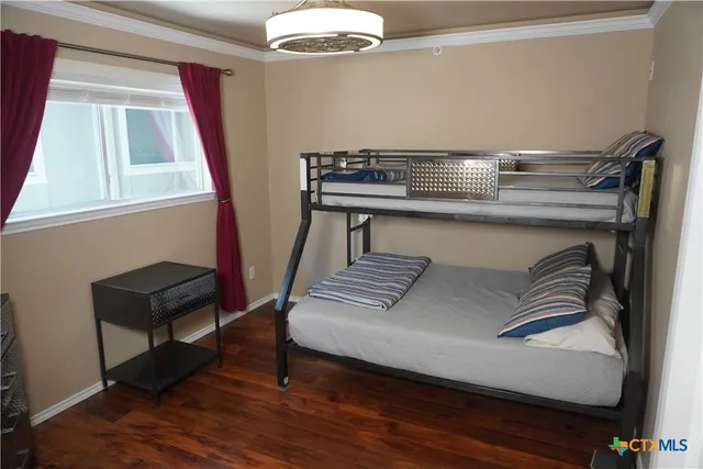 a view of hallway with chair and a couch