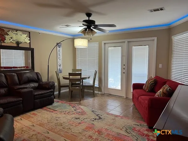 a living room with furniture and a large window