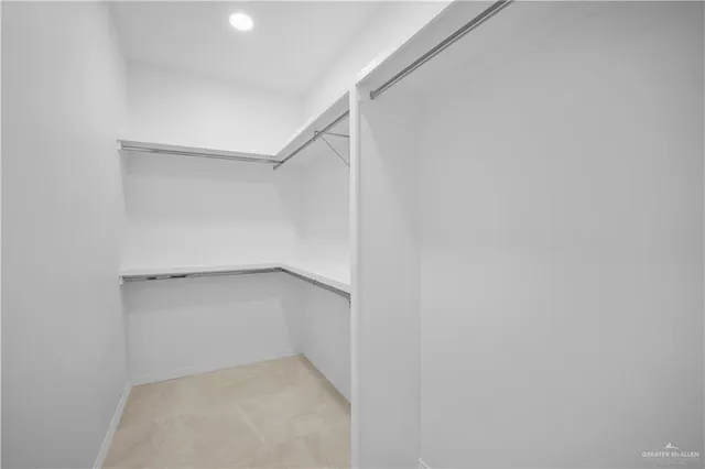 a view of an empty walk in closet
