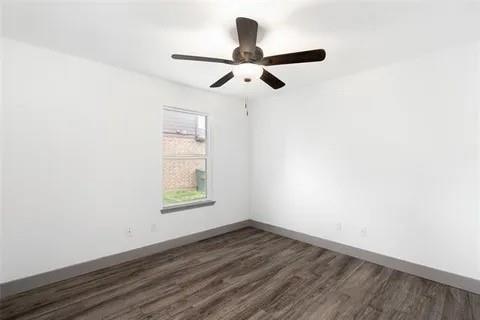 1404 Swan Ridge Drive Sherman, TX 75092 - Photo 13 of 16 a view of empty room with wooden floor and fan