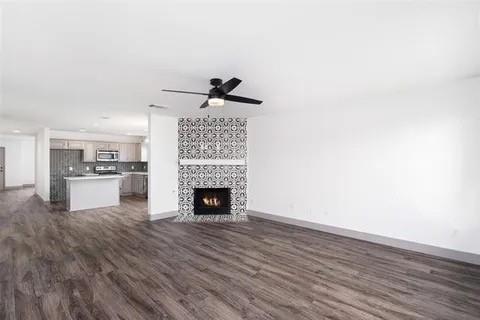 1404 Swan Ridge Drive Sherman, TX 75092 - Photo 4 of 16 a view of empty room with wooden floor and fireplace