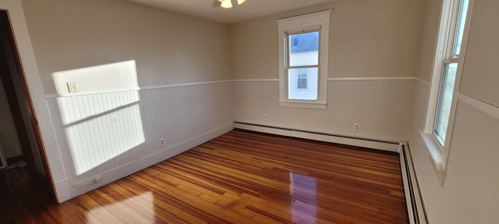 91 Rimmon Avenue Chicopee, MA 01013 - Photo 12 of 18 a view of a room with wooden floor and window