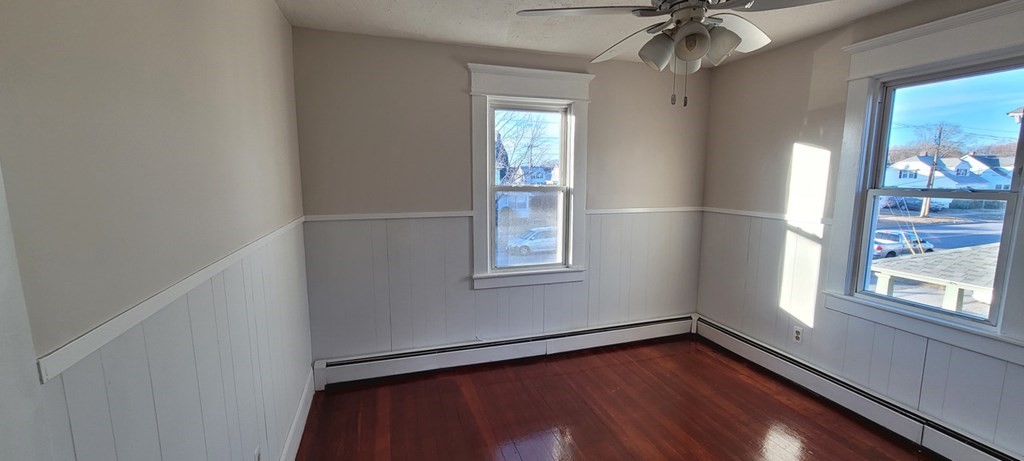 91 Rimmon Avenue Chicopee, MA 01013 - Photo 14 of 18 a view of an empty room with a window and wooden floor