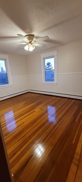 91 Rimmon Avenue Chicopee, MA 01013 - Photo 15 of 18 a view of room with window and wooden floor