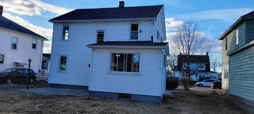 91 Rimmon Avenue Chicopee, MA 01013 - Photo 18 of 18 a view of a house with a yard and furniture