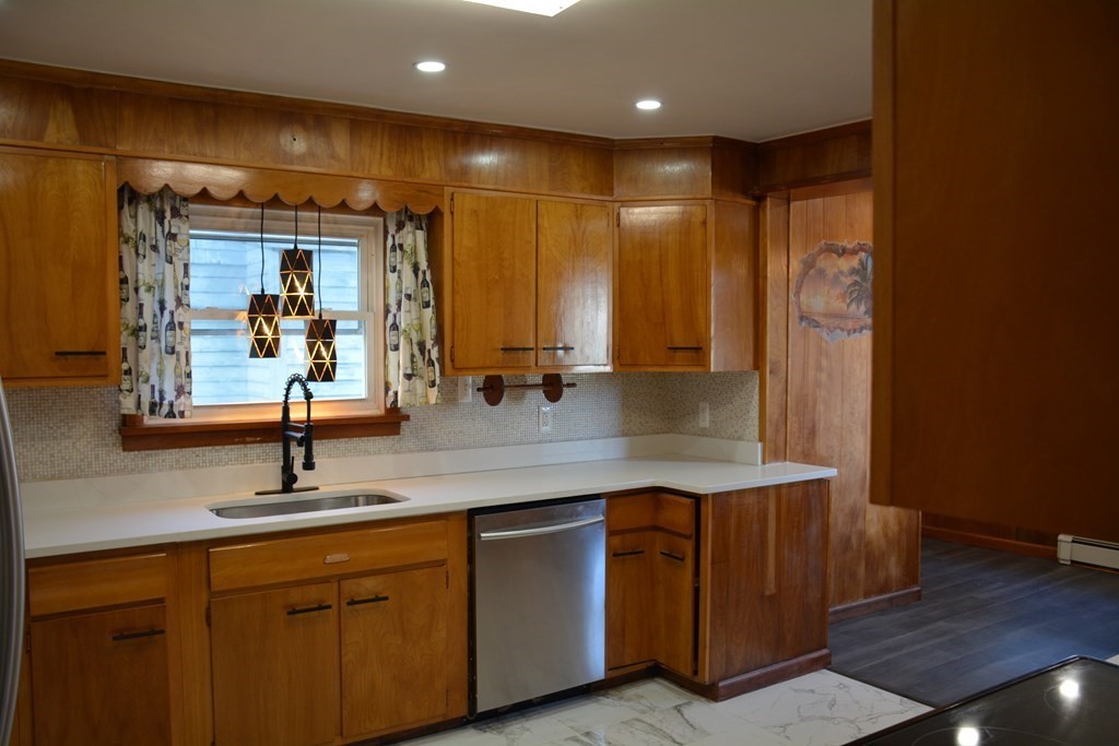 91 Rimmon Avenue Chicopee, MA 01013 - Photo 4 of 18 a bathroom with a double vanity sink and a mirror