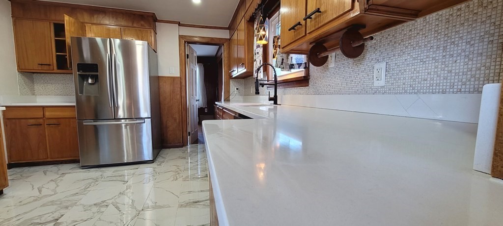91 Rimmon Avenue Chicopee, MA 01013 - Photo 7 of 18 a kitchen with stainless steel appliances a refrigerator and a counter