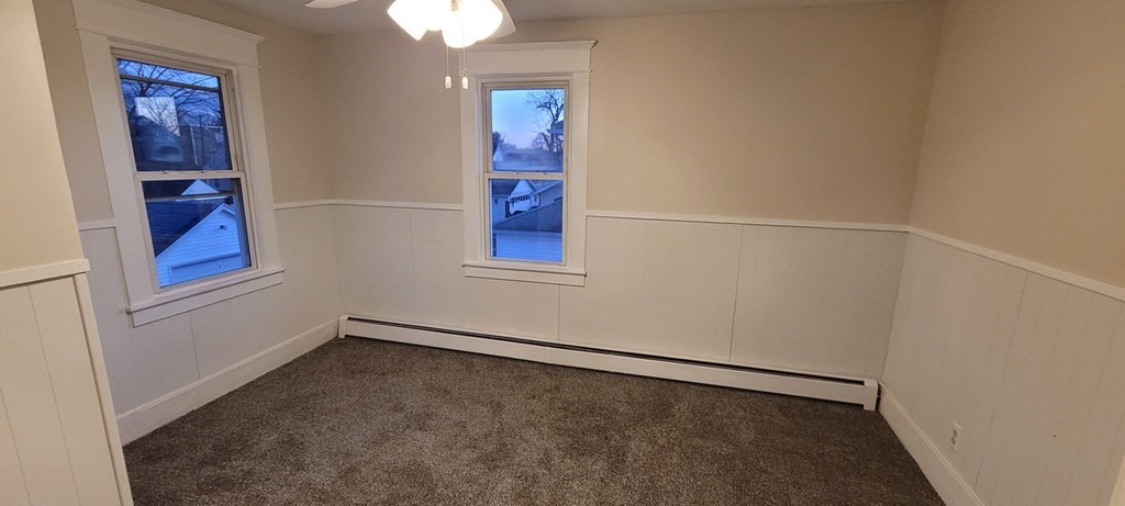 91 Rimmon Avenue Chicopee, MA 01013 - Photo 10 of 18 an empty room with windows and fan