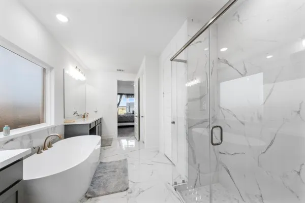 a bathroom with a double vanity sink a mirror and a shower