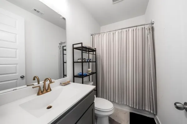 a bedroom with a bed and a television