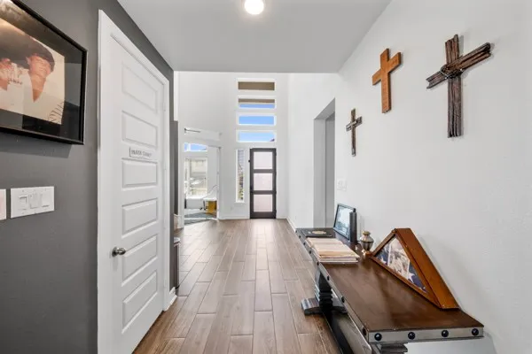 a view of a workspace with furniture and a flat screen tv