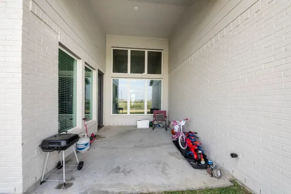 a view of a chairs and tables in front of a house