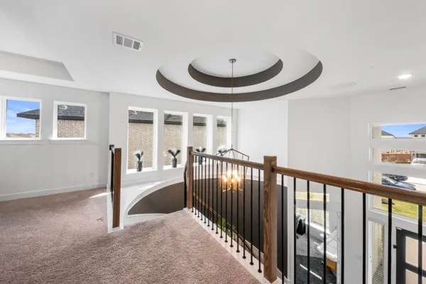 a view of a livingroom with furniture and staircase