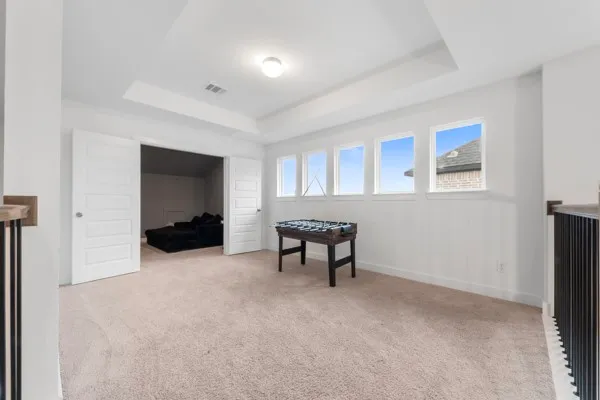 a view of a livingroom with furniture and a window
