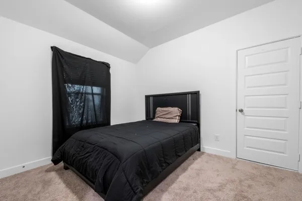 a bedroom with a bed and a closet