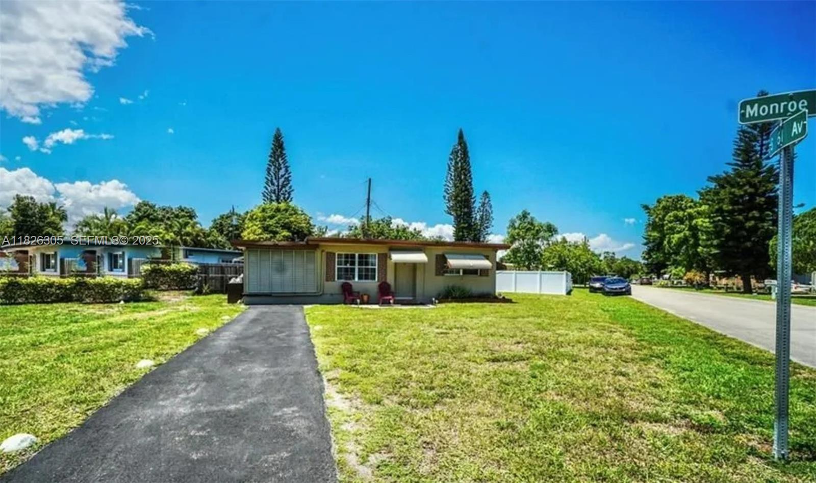 6103 Monroe Street Hollywood, FL 33023 - Photo 2 of 9 a view of a patio with a table and chairs