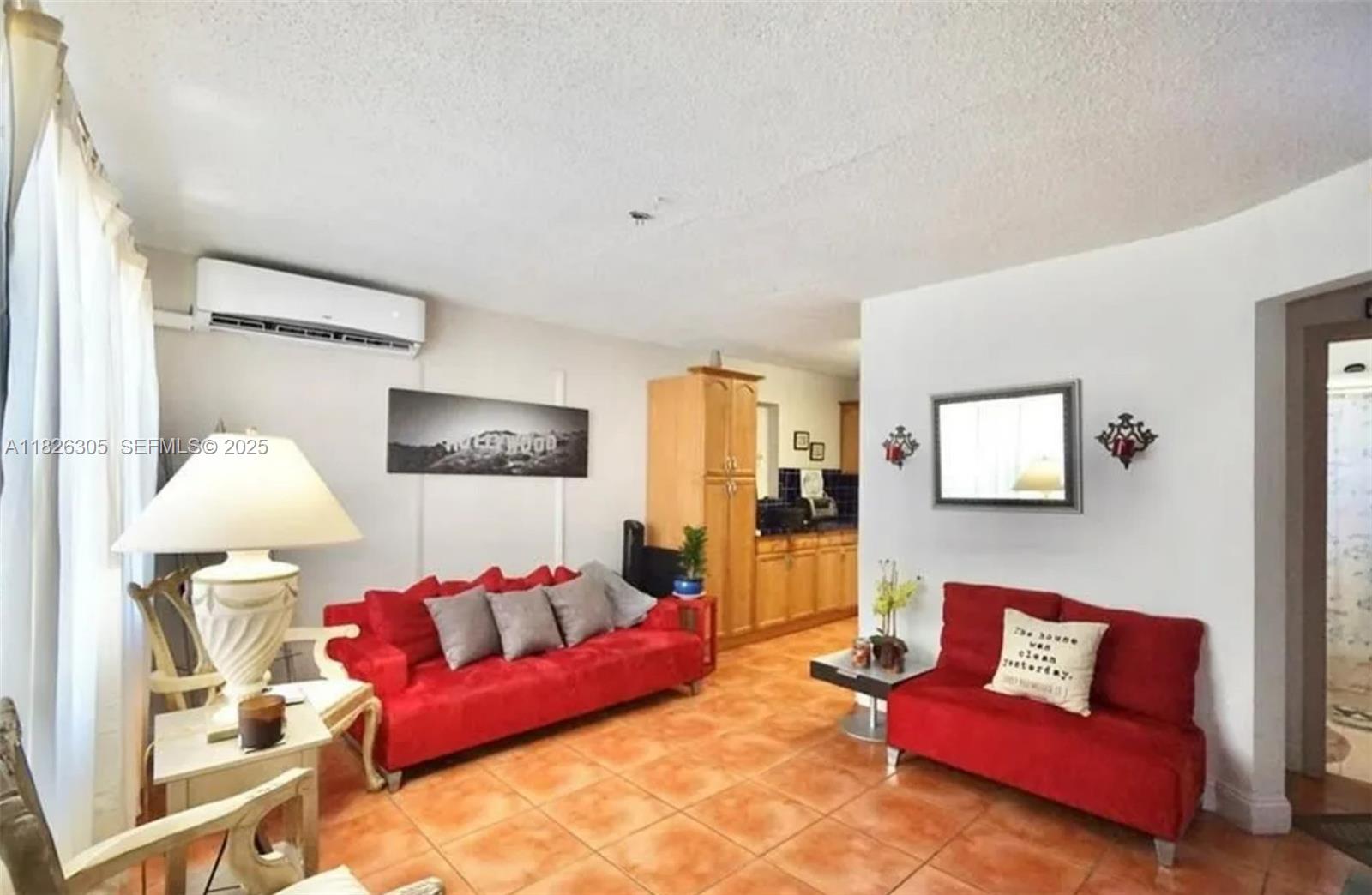 6103 Monroe Street Hollywood, FL 33023 - Photo 5 of 9 a living room with furniture and a couch