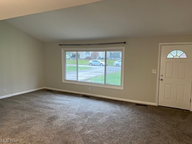 3052 Bancroft Road Akron, OH 44333 - Photo 2 of 11 Carpeted living room featuring plenty of natural light and vaulted ceiling