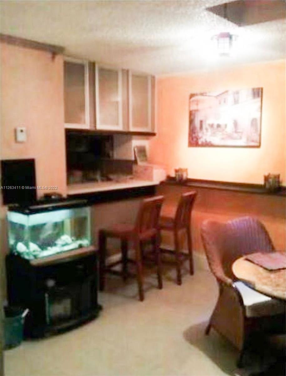 422 Northwest 8th Street Miami, FL 33136 - Photo 3 of 4 a living room with furniture and a fireplace