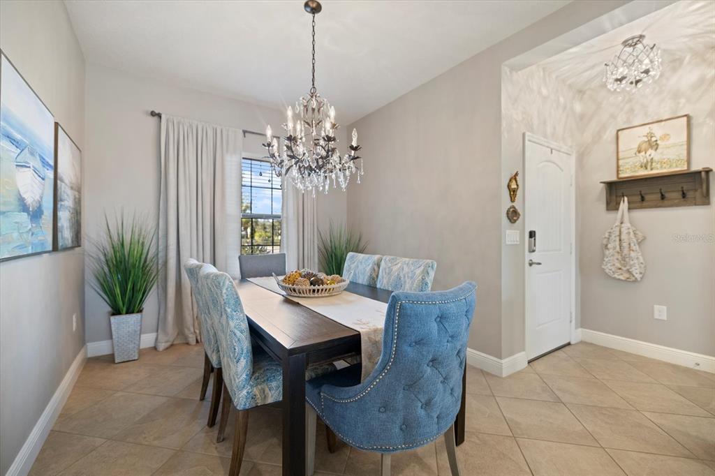 208 Brienza Loop Nokomis, FL 34275 - Photo 12 of 45 a view of a dining room with furniture and chandelier