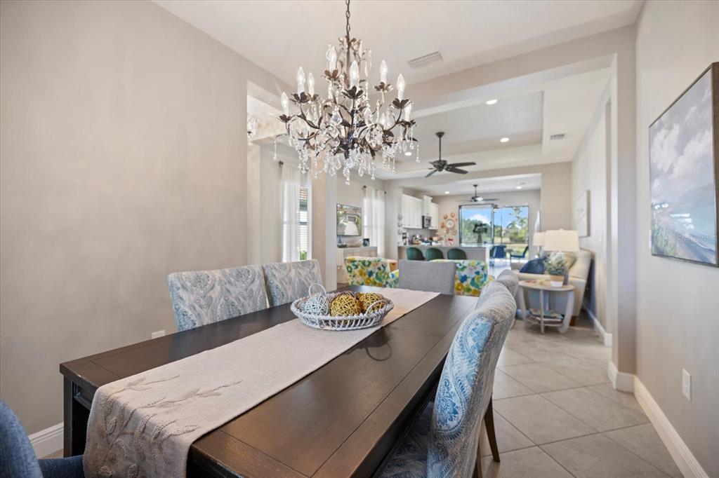 208 Brienza Loop Nokomis, FL 34275 - Photo 14 of 45 a living room with furniture and a chandelier