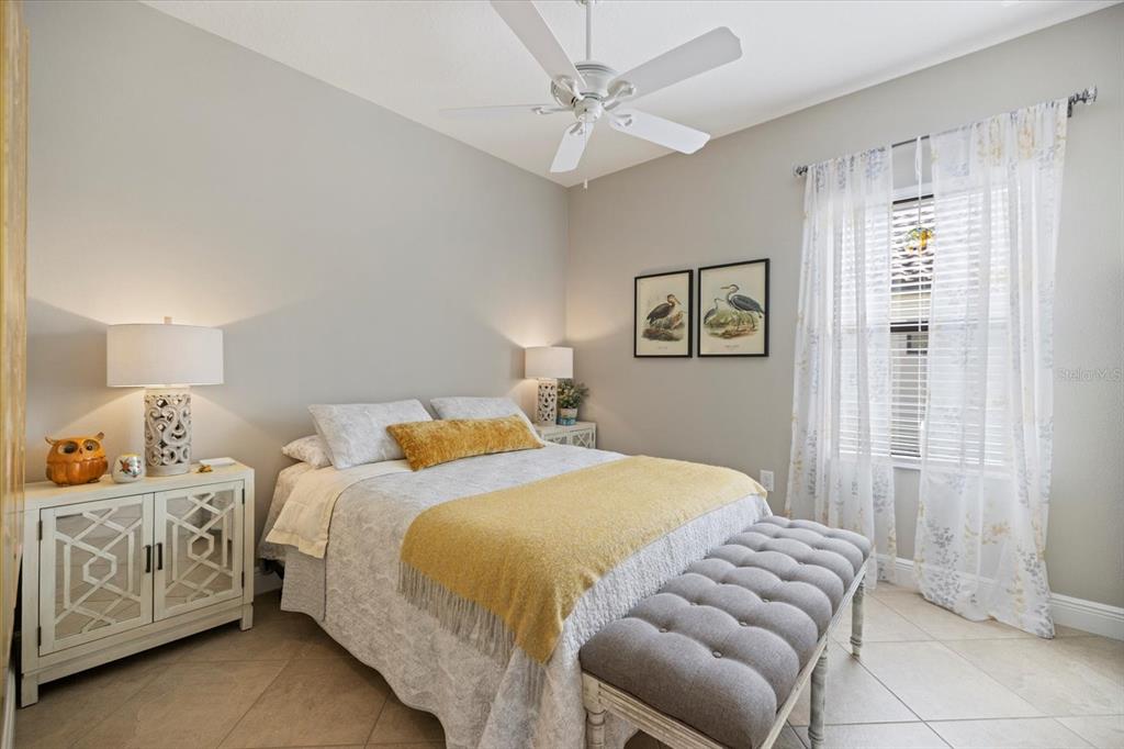 208 Brienza Loop Nokomis, FL 34275 - Photo 20 of 45 a bedroom with a bed and window