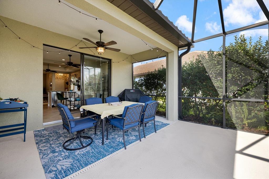 208 Brienza Loop Nokomis, FL 34275 - Photo 24 of 45 a dining room with furniture and wooden floor