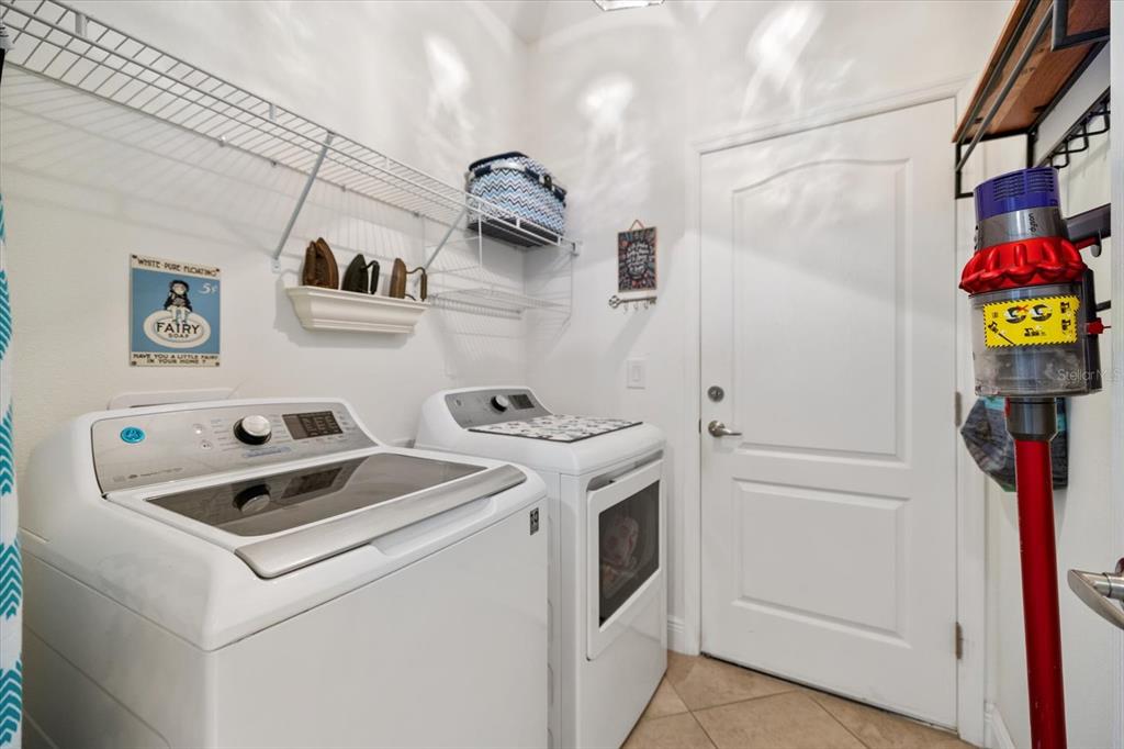 208 Brienza Loop Nokomis, FL 34275 - Photo 28 of 45 a utility room with dryer and washer