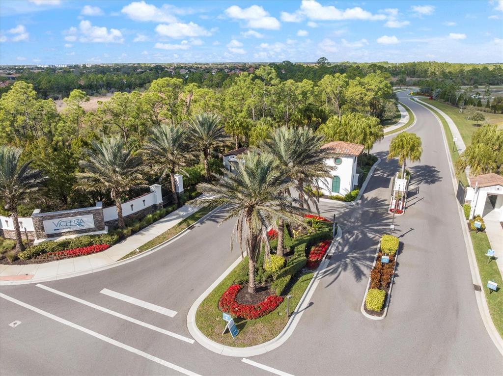 208 Brienza Loop Nokomis, FL 34275 - Photo 30 of 45 a view of a swimming pool with an outdoor seating and a garden