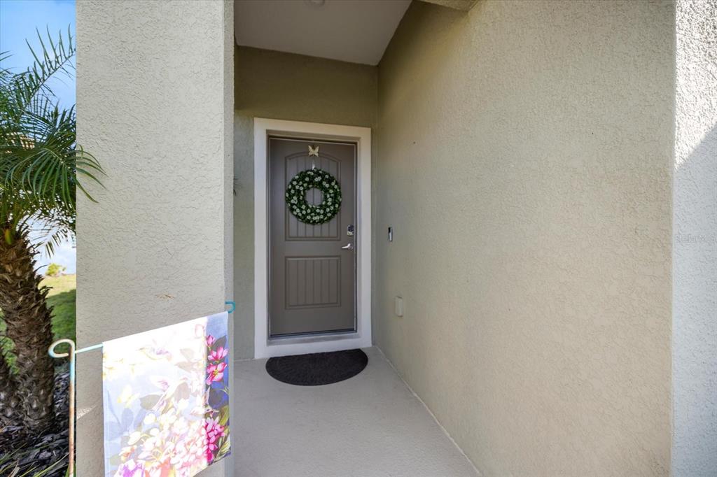 208 Brienza Loop Nokomis, FL 34275 - Photo 3 of 45 a view of a hallway with entryway