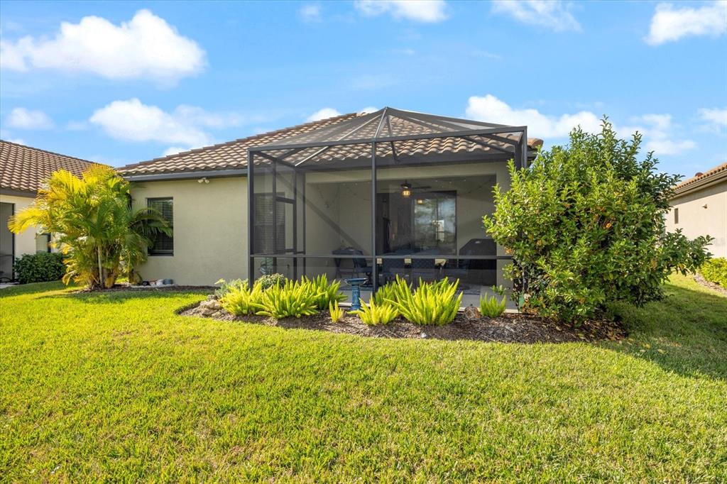 208 Brienza Loop Nokomis, FL 34275 - Photo 36 of 45 a view of a house with a yard