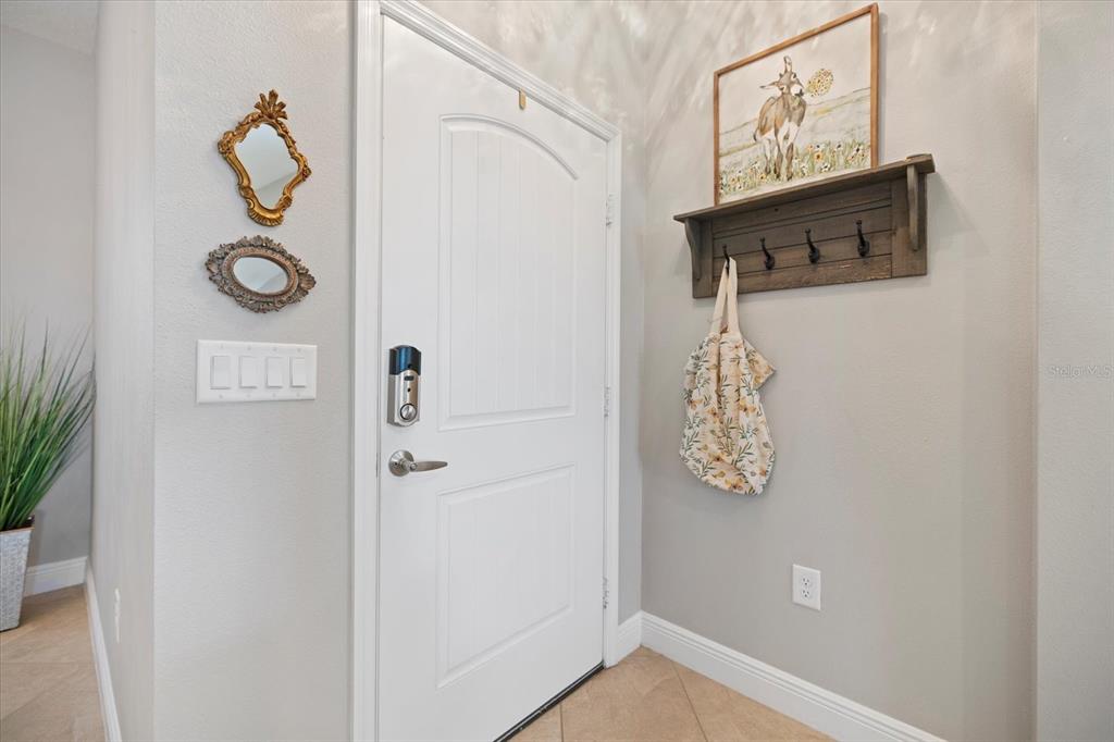 208 Brienza Loop Nokomis, FL 34275 - Photo 4 of 45 a bathroom with a shower and mirror