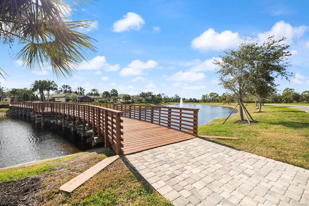 208 Brienza Loop Nokomis, FL 34275 - Photo 41 of 45 a view of a lake with a yard