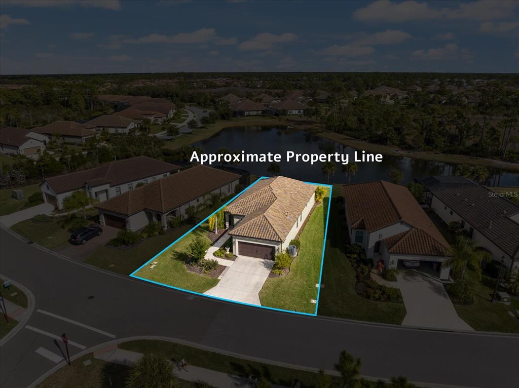 208 Brienza Loop Nokomis, FL 34275 - Photo 45 of 45 an aerial view of a house with a yard