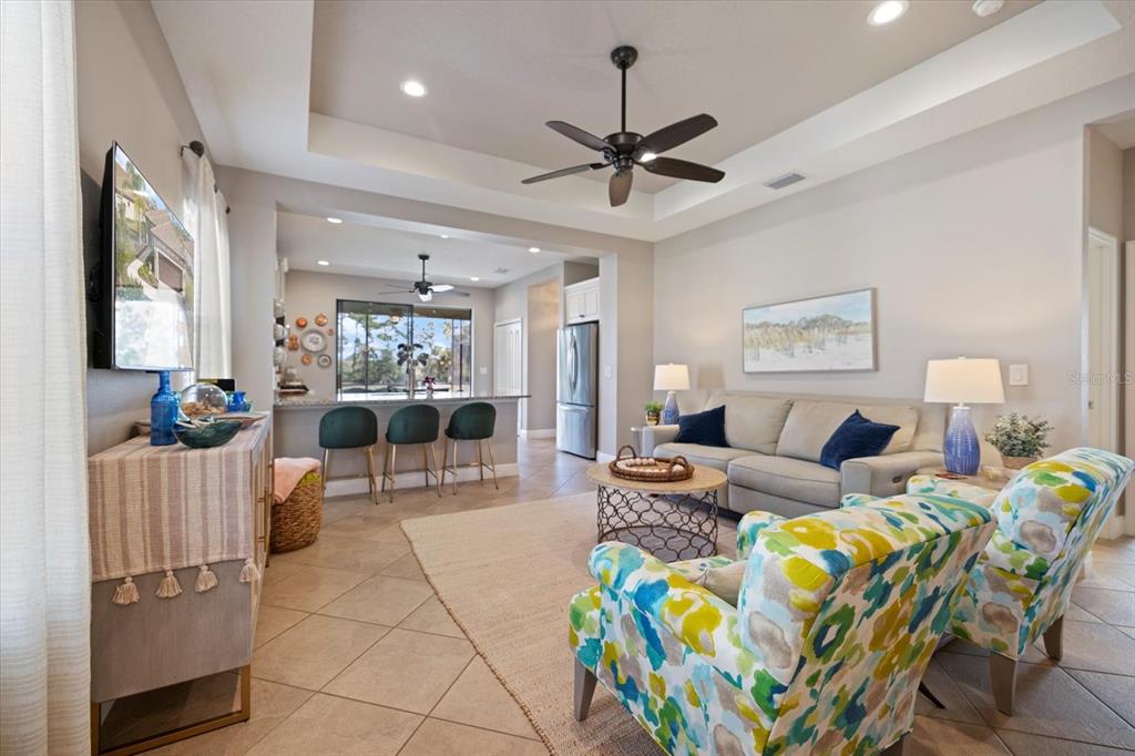 208 Brienza Loop Nokomis, FL 34275 - Photo 5 of 45 a living room with fireplace furniture and a chandelier