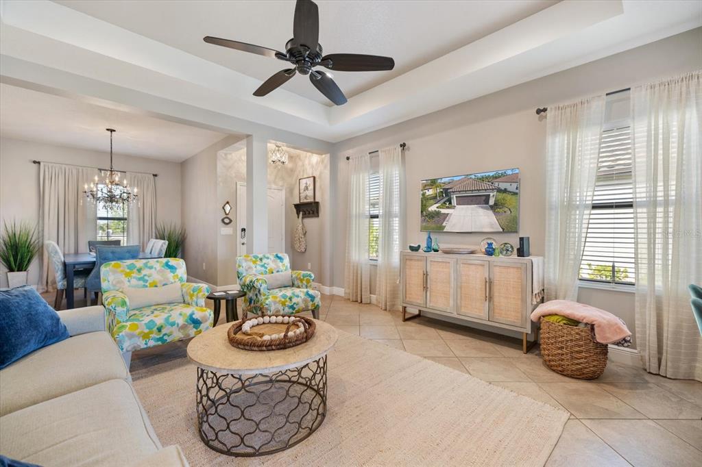 208 Brienza Loop Nokomis, FL 34275 - Photo 6 of 45 a living room with furniture and a flat screen tv