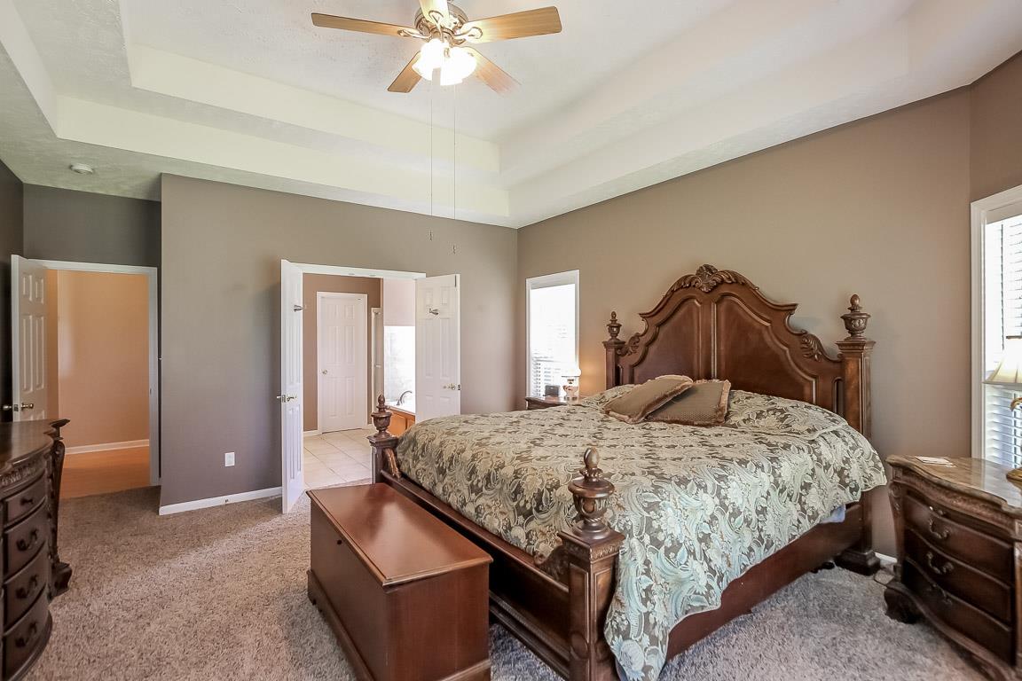 1485 Bend Road Clarksville, TN 37040 - Photo 14 of 28 a bedroom with a bed and a chandelier