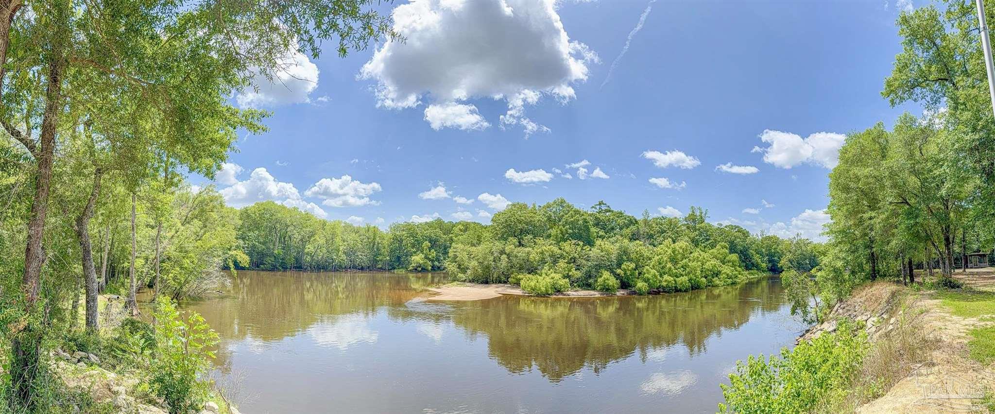 a view of a lake with a building in the background
