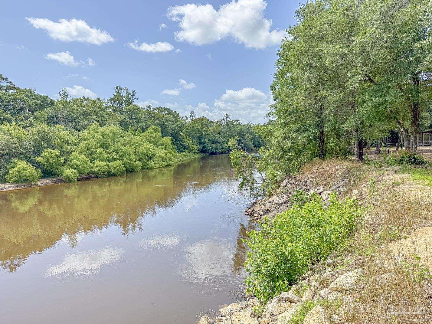 4020 Easy Street Holt, FL 32564 - Photo 12 of 19 a view of a lake with houses in the back