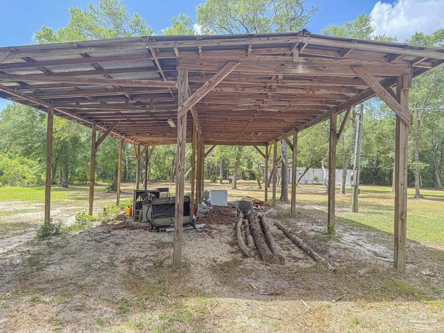4020 Easy Street Holt, FL 32564 - Photo 18 of 19 a view of a roof deck with a small deck