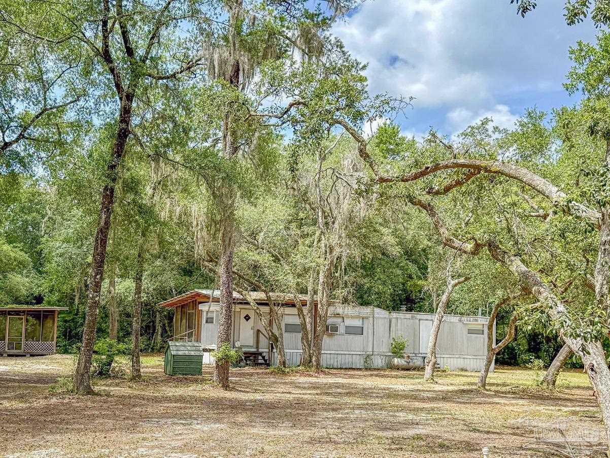 4020 Easy Street Holt, FL 32564 - Photo 9 of 19 a view of a house with a yard