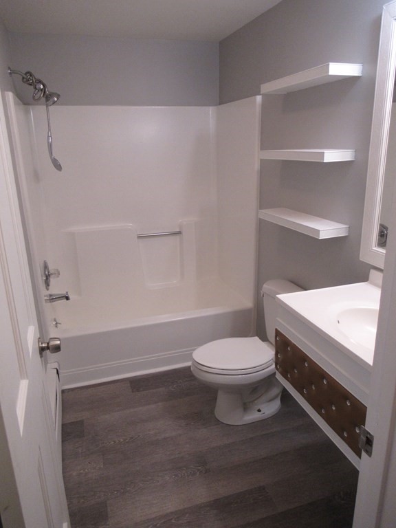 30 Clayton Street, Unit E Springfield, MA 01107 - Photo 12 of 27 a bathroom with a toilet and a shower