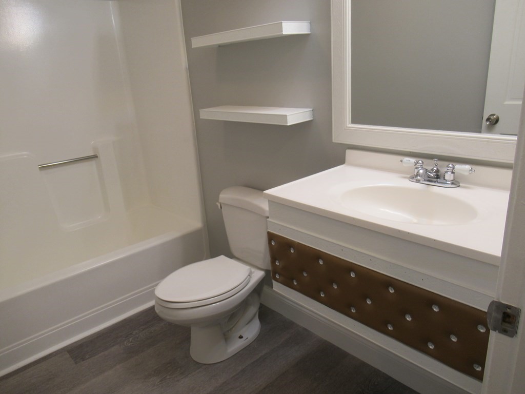 30 Clayton Street, Unit E Springfield, MA 01107 - Photo 13 of 27 a bathroom with a toilet sink and mirror