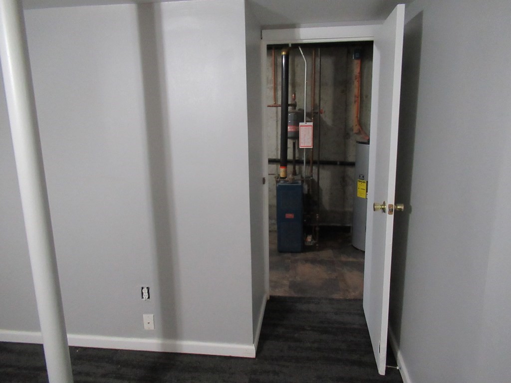 30 Clayton Street, Unit E Springfield, MA 01107 - Photo 22 of 27 a view of a hallway with wooden floor and a small space
