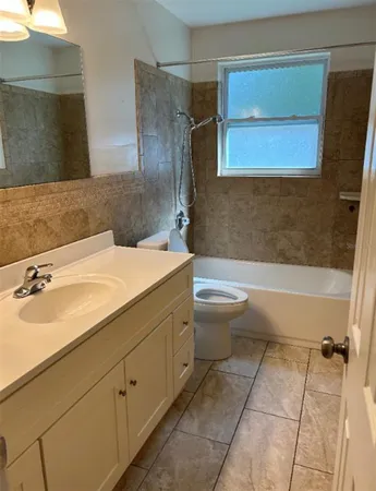 a bathroom with a sink a toilet and a bathtub